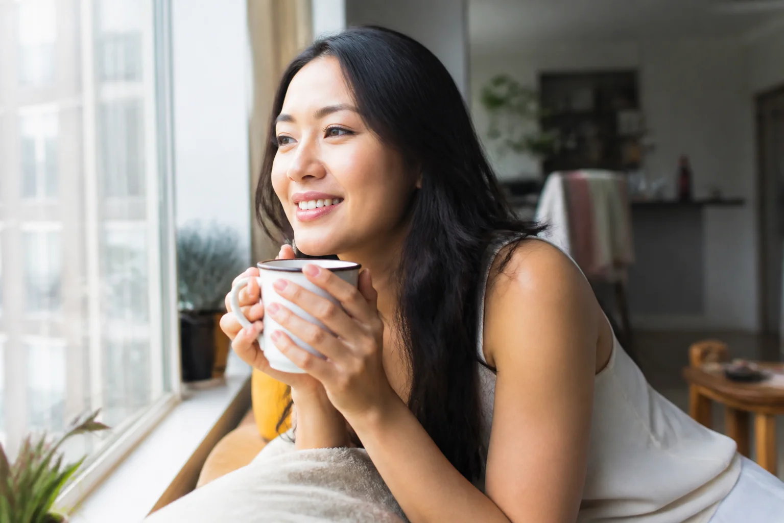 A woman enjoying a quiet moment at home